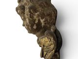 statue of a man with a bird on his shoulder