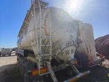 a large tanker truck that is parked on the side of the road