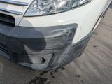 a white van that is parked in the parking lot