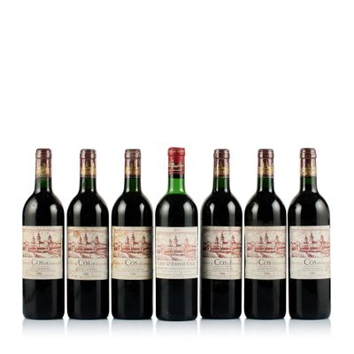 six bottles of red wine lined up in a row