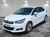 a white citrole is parked in a room with a checkered floor