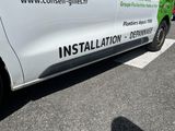 a white van that is parked in a parking lot