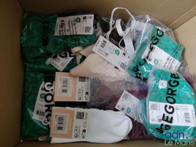 a box full of assorted items that include socks, socks, and other items