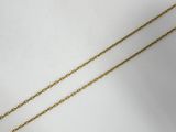 a gold necklace with a chain that is attached to it