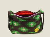 the small purse is green and purple with polka dots on it