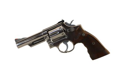 a close up of a revolver on a white background