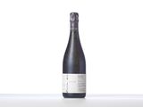 a close up of a bottle of wine on a table