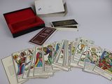 a lot of tarot cards in a box on a table