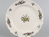an image of a plate with a bird and flowers on it