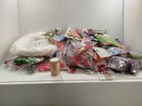 a pile of craft supplies sitting on a counter