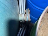 a blue barrel and a green barrel next to each other
