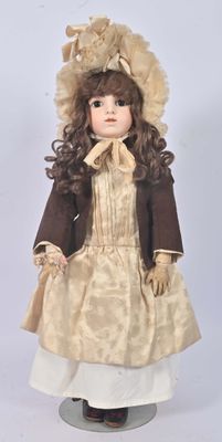 a doll that is wearing a dress and a hat
