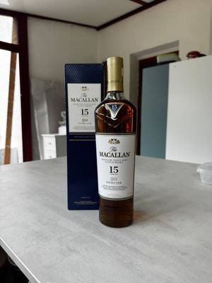 the bottle of macallan 15 years old is sitting on the counter