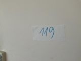 a white refrigerator with a blue sticker on it