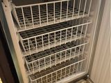 dishwasher and dryer in a kitchen with wood flooring