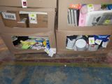 two cardboard boxes with items in them on the floor