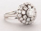 an image of a diamond cluster ring on a white background