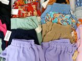 many different types of shorts laid out on a table