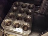 an image of a muffin pan in a commercial kitchen