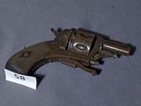 a small gun that is on a table