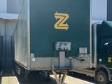 two trucks that are parked in front of a building