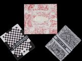 three cards with different designs on them on a black background