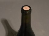 a bottle of wine that is sitting on a table