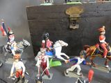 many figurines of soldiers on display on a table