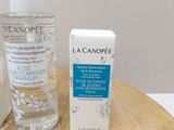 a bottle of lotion and a bottle of lotion sitting on a table