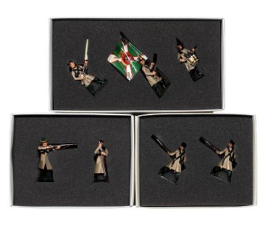 four figurines of soldiers in different poses