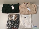 three pairs of shirts and a pair of pants on a table
