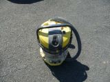 a yellow and black backpack with a camera attached to it