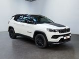 a white jeep compass is parked in a white room