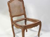 an old wooden chair with a glass seat on a white background