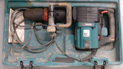 a blue box with a drill and other tools in it