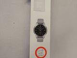 a box with a watch on it that has a sticker on it