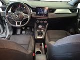 the interior of a car with a steering wheel, dashboard, and dashboard controls