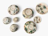 many different types of porcelain bowls and bowls on the table