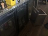 a bar with a bunch of bottles on the counter