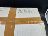 a stack of boxes sitting on top of a black table