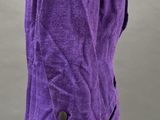 a mannequin dressed in a purple jacket and black pants