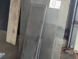 several pieces of metal are stacked up in a garage