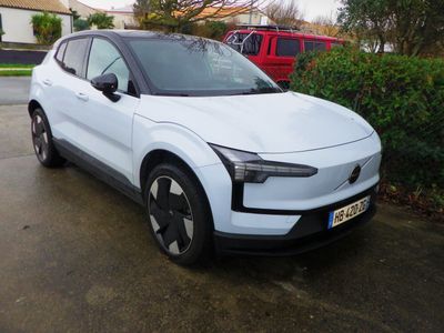 a white car parked on the side of the road