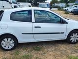 a picture of a small white car parked in a lot