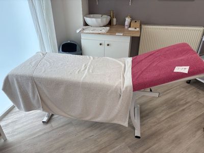 a woman laying on a bed in a room