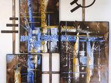painting on the wall of a room with a clock and paintings on the wall