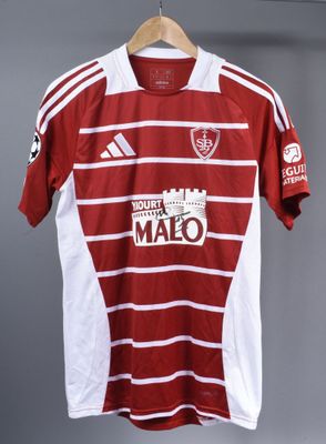 a red and white soccer shirt hanging on a hanger