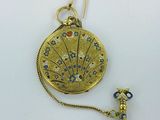 an image of a gold locke with a chain attached to it