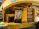 a large yellow machine that is parked in the parking lot