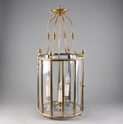 a large brass lantern hanging from the ceiling